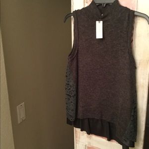 Anthropologie sweater with back lace detail.